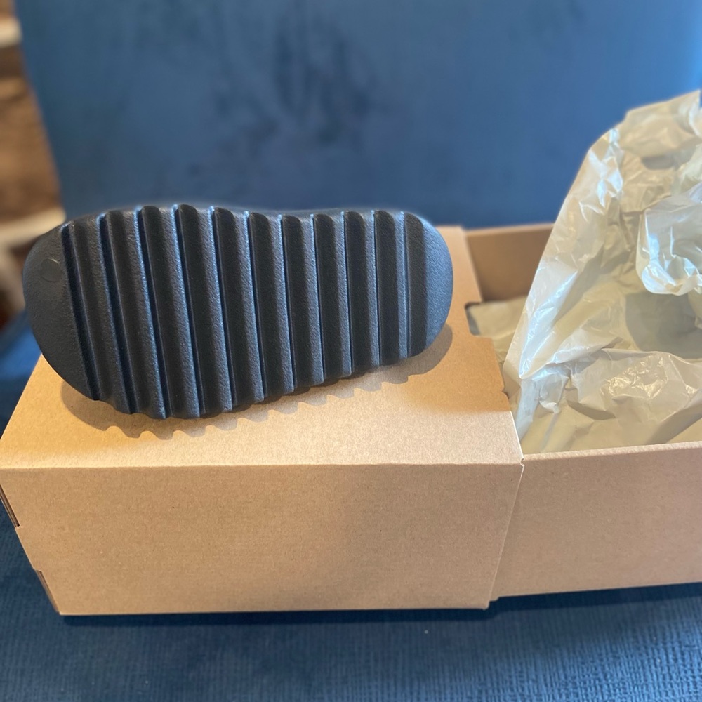 Yeezy slides , brand new ,Never worn . New with tags and box.